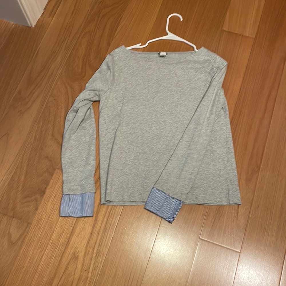 JCrew grey with blue striped sleeve detail boatneck shirt.